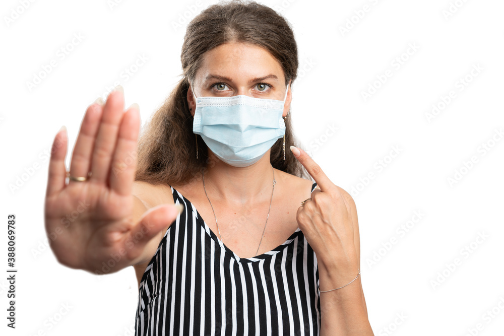Female making stop stay away gesture pointing at medical mask Female making stop stay away gesture pointing at medical mask