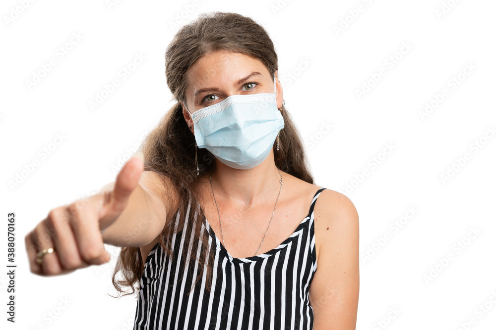 Woman covering nose and mouth with mask making thumb up gesture