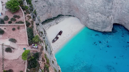 Tourists Viewing Shipwreck From Cliff photo