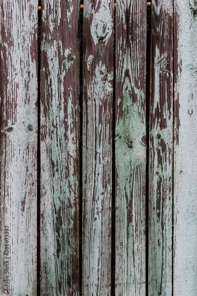 Background and texture of old wooden fence with faded green paint Background and texture of old wooden fence with faded green paint
