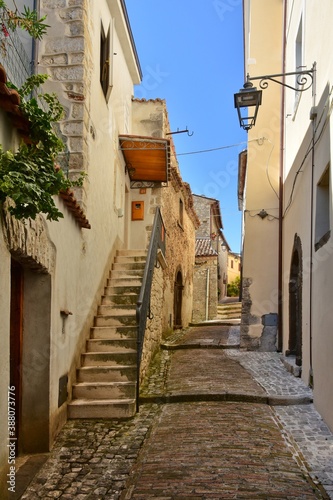 A narrow street among the old stone houses of Castro dei Volsci, a medieval village in the province of Frosinone in Italy. © Giambattista