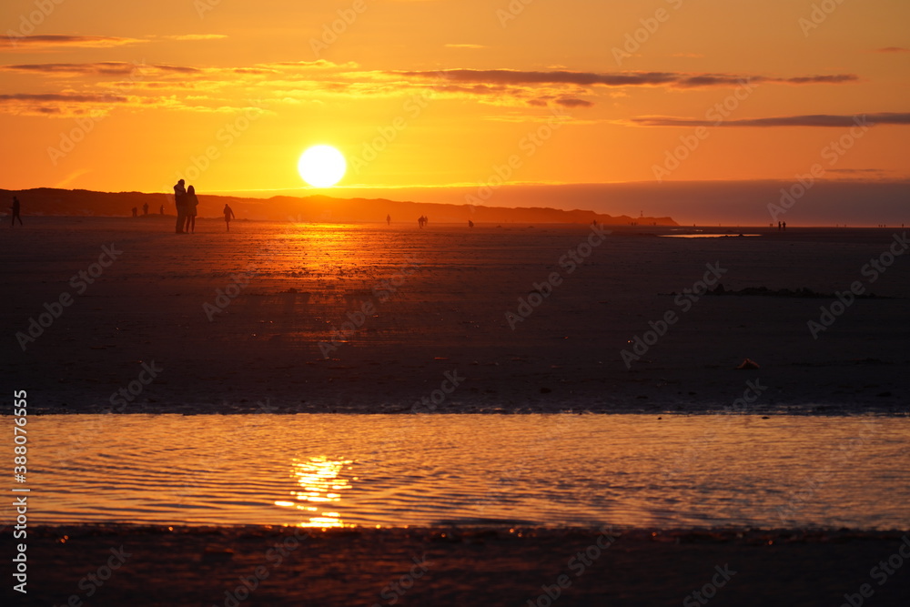 Glaring Red Sunset on the Beach of Juist. High quality photo Glaring Red Sunset on the Beach of Juist. High quality photo
