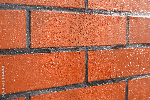 . A natural stone covered with a protective liquid from moisture and mold. Protect the stone from moisture. Drops of water on a rock. Hydrophobicity.