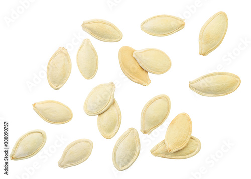Pumpkin seeds falling on a white background, isolated. Levitating Pumpkin Seeds