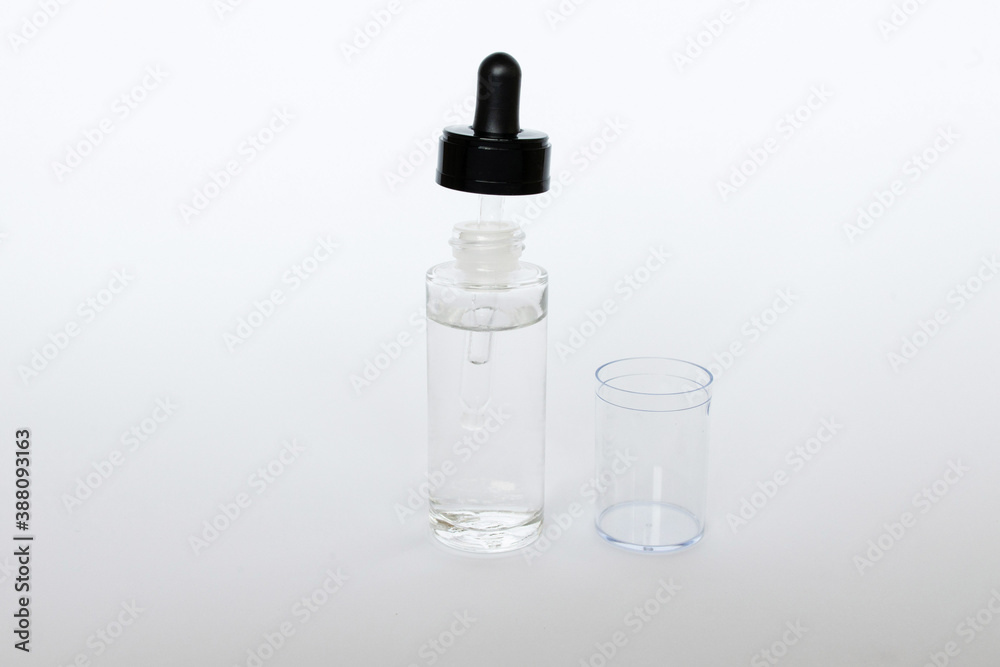 Dropper glass Bottle Mock-Up. Сosmetic pipette on white background Dropper glass Bottle Mock-Up. Сosmetic pipette on white background