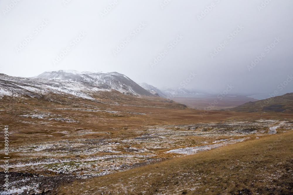 snow covered mountains in foggy autumn landscape in Snæfellsnes, Iceland