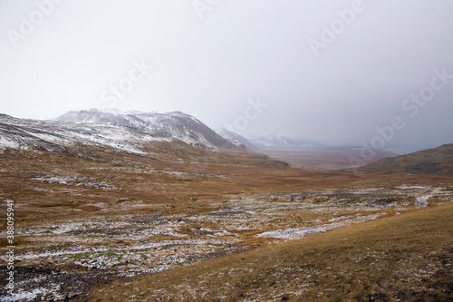 snow covered mountains in foggy autumn landscape in Snæfellsnes, Iceland