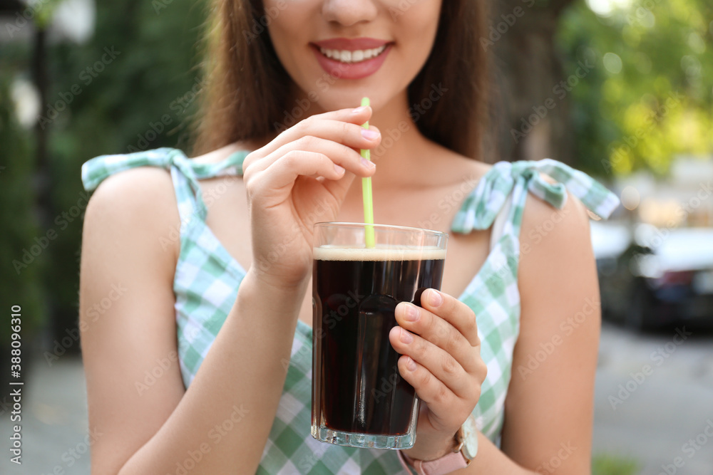 Young woman with cold kvass outdoors, closeup. Traditional Russian summer drink Young woman with cold kvass outdoors, closeup. Traditional Russian summer drink