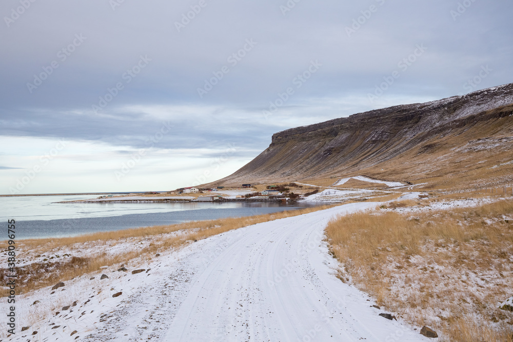 snow covered road along the bay in Snæfellsnes, Iceland snow covered road along the bay in Snæfellsnes, Iceland