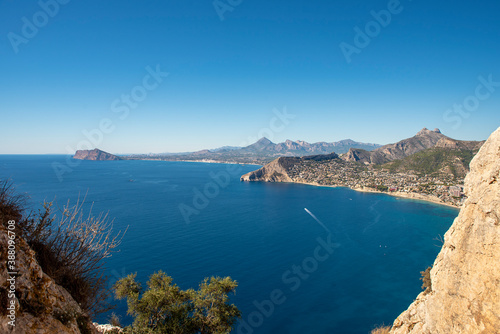 Landscape of the city of Calpe from the top of the Peñon de Ifach natural park, with clear blue skies.