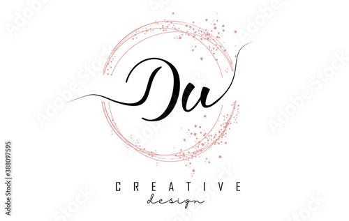 Handwritten Du D u letter logo with sparkling circles with pink glitter.