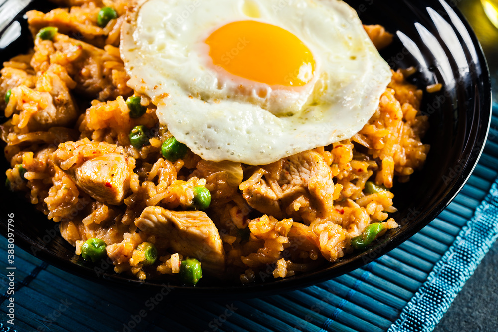 Spicy fried rice with chicken, kimchi and egg Spicy fried rice with chicken, kimchi and egg