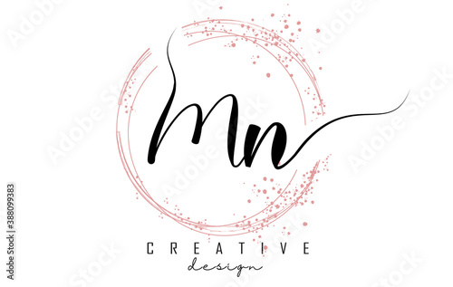 Handwritten Mn M n letter logo with sparkling circles with pink glitter.