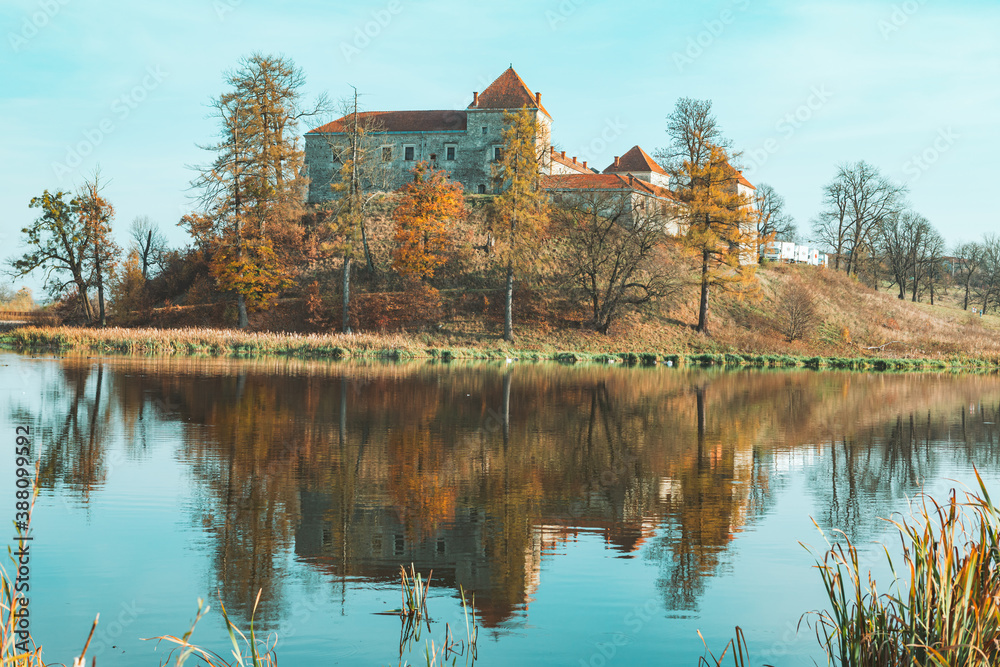 Fototapeta premium view of old european castle lake in front
