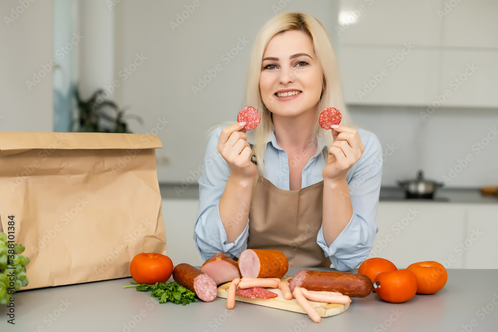 Self Isolation Concept. woman unpacking paper bag with food in kitchen, ready for quarantine during epidemic outbreak Self Isolation Concept. woman unpacking paper bag with food in kitchen, ready for quarantine during epidemic outbreak