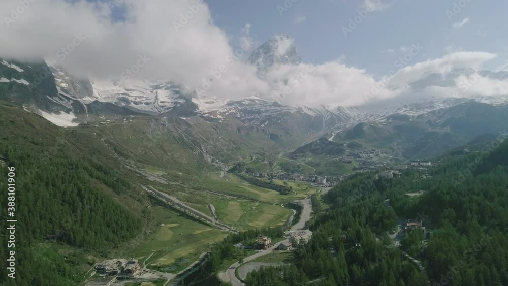 Drone perspective flying over lush idyllic European alpine valley Drone perspective flying over lush idyllic European alpine valley