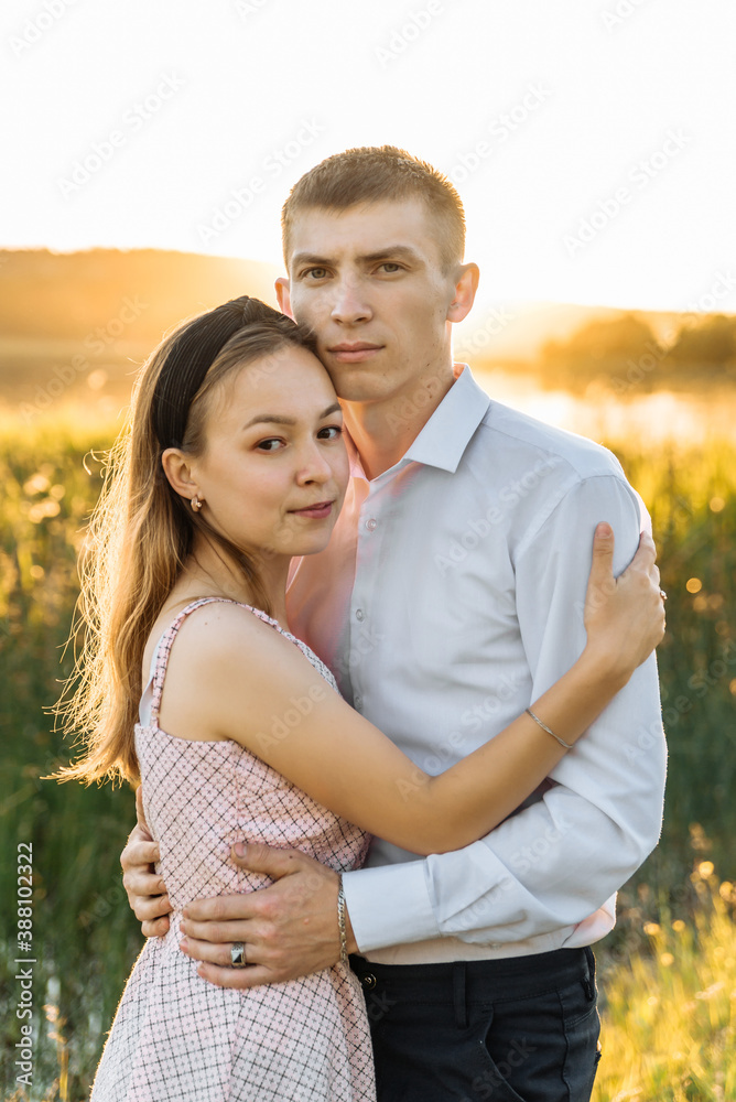 a couple in love on a walk in nature.Romance and love in the setting sun