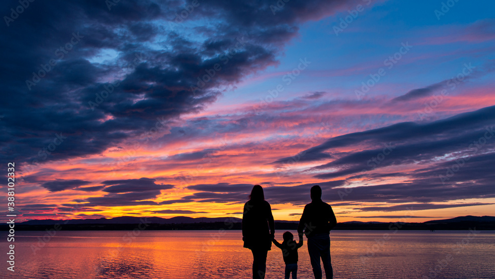 sunset family reflection colorful sky clouds landscape