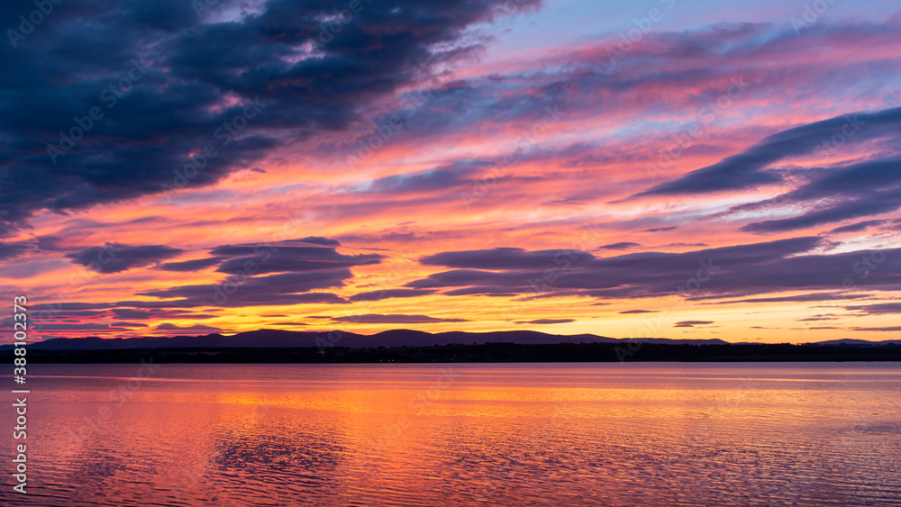 Fototapeta premium sunset reflection colorful sky clouds landscape