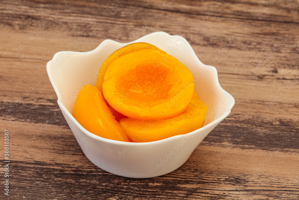 Marinated peaches fruit in the bowl Marinated peaches fruit in the bowl