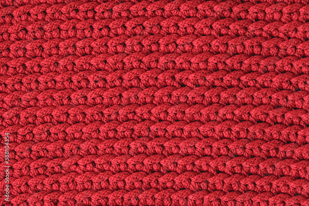 Red knitted fabric texture background. Top view. Copy, empty space for text Red knitted fabric texture background. Top view. Copy, empty space for text