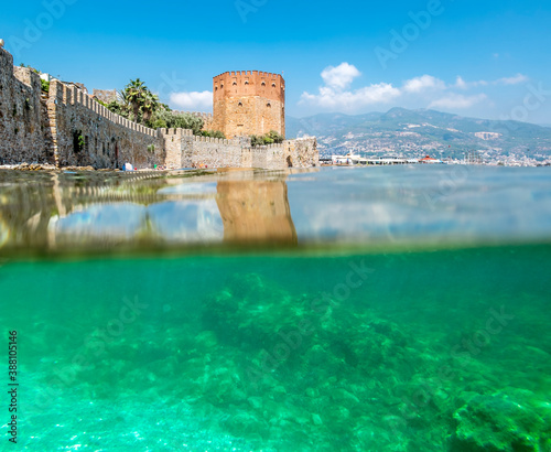 View of the walls of the ancient fortress and the tower of Kyzyl Kule in Alanya in Turkey