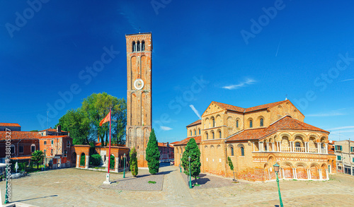 Church of Santa Maria e San Donato and bell tower brick building on Campo San Donato square in Murano islands, Province of Venice, Veneto Region, Northern Italy. Murano postcard cityscape.