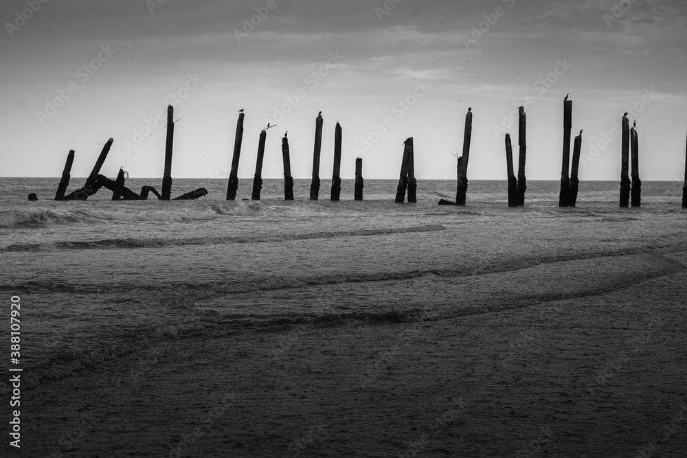 Atlantic peer lost to the ocean with low waves
