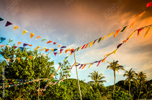 triangular colorful flag decoration with tropical background