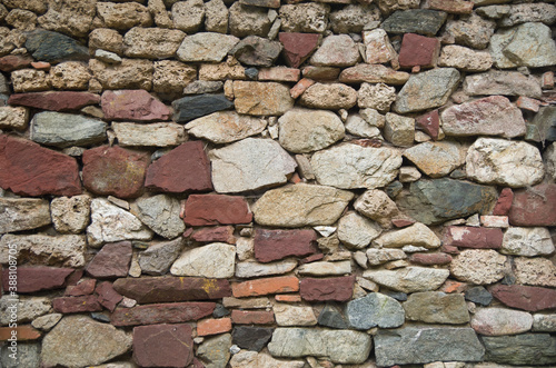 Old colorful stone wall closeup