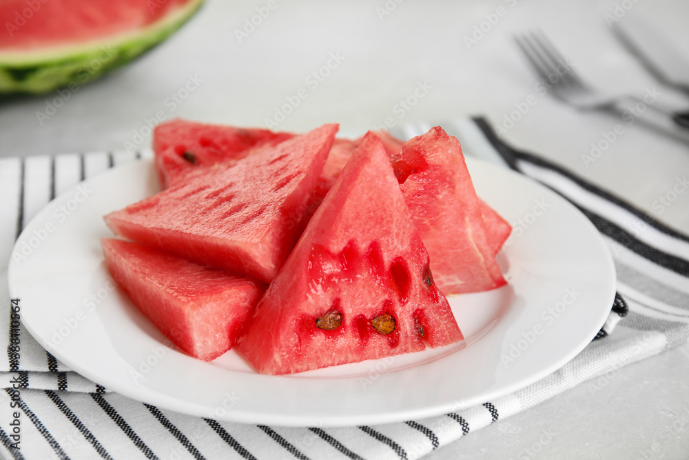 Yummy watermelon slices on white table, closeup Yummy watermelon slices on white table, closeup