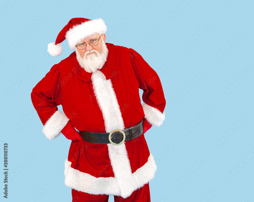 An angry Santa Claus isolated on blue. An angry Santa Claus isolated on blue.