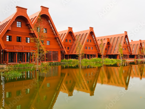 Photography Red Wood buildings with geometric design and reflections shanghai China