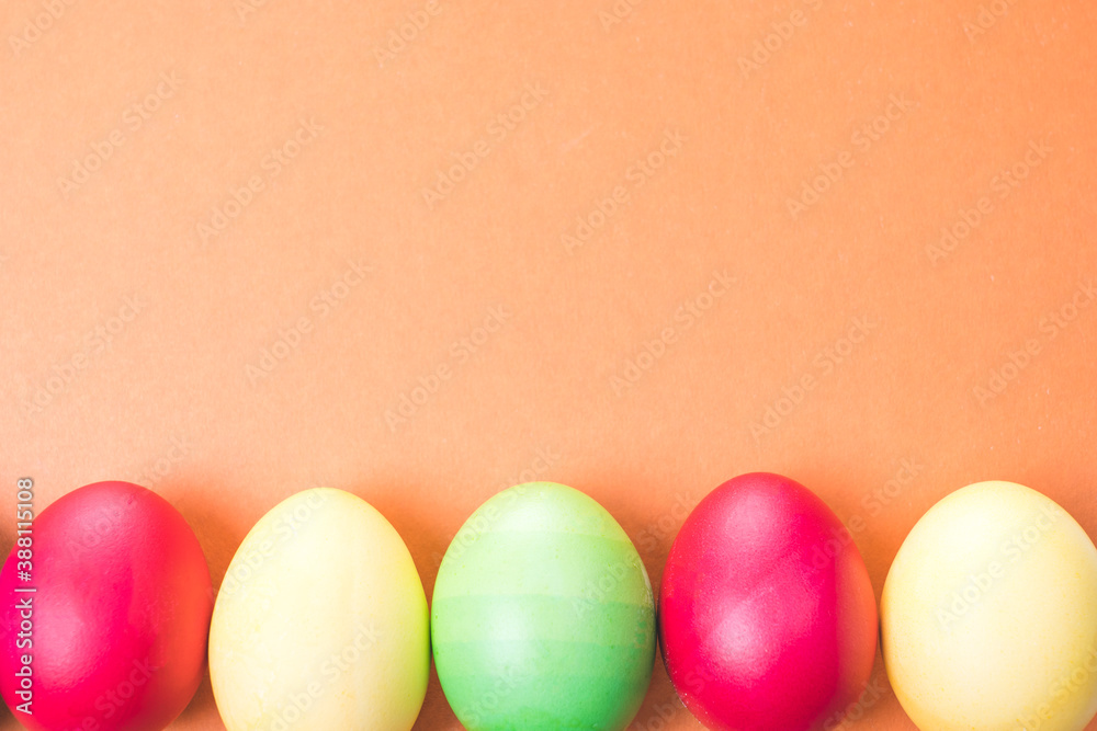multicolored Easter eggs on a brown background, close-up multicolored Easter eggs on a brown background, close-up