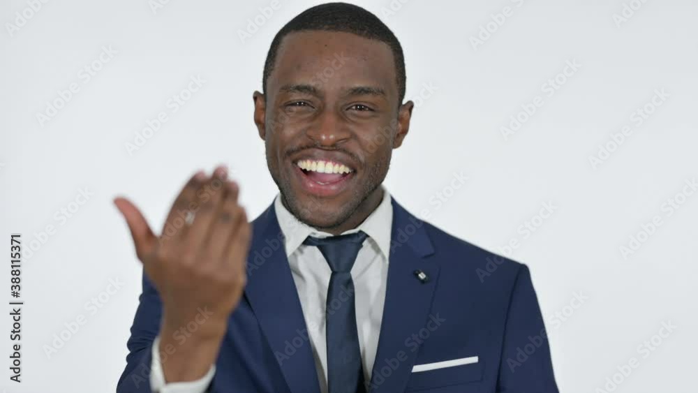 African Businessman Pointing and Inviting, White Background African Businessman Pointing and Inviting, White Background