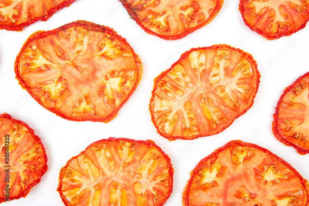 slices of dried tomato on a white background. vitamin vegetable food slices of dried tomato on a white background. vitamin vegetable food