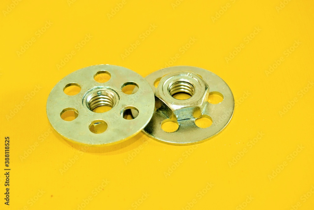 Obraz premium Bonding fastener for composite products. Metric 8 hexagonal nut and base plate with holes in base plate.