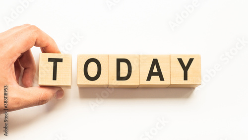 Word today. Wooden small cubes with letters isolated on white background with copy space available.Business Concept image.