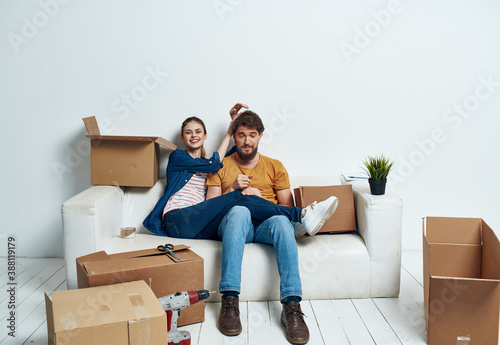 Cheerful young couple in an apartment boxes with things moving  © SHOTPRIME STUDIO