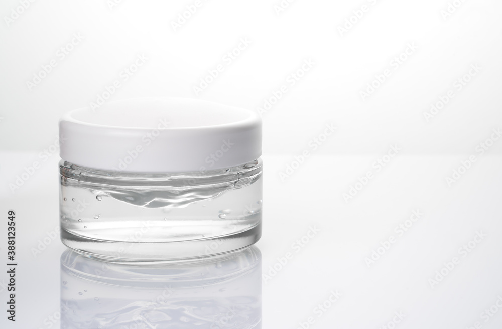 Face cream in a glass jar on a light background. The concept of skin health. Face cream in a glass jar on a light background. The concept of skin health.