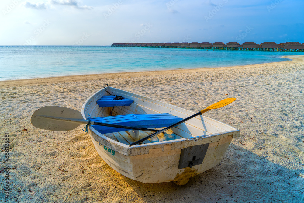 View of nice tropical beach with old boat