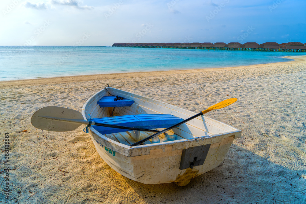 View of nice tropical beach with old boat View of nice tropical beach with old boat