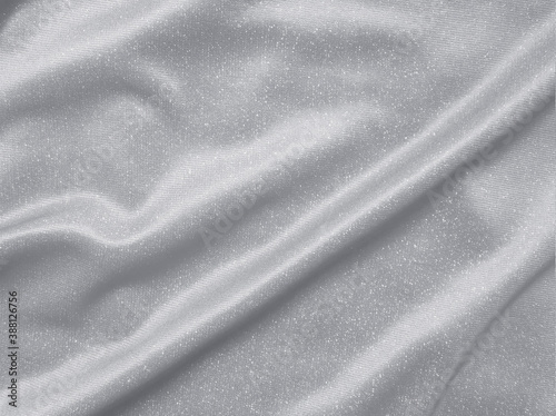 Shiny silver crumpled fabric texture background