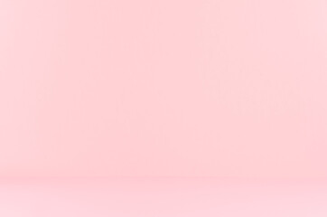 Soft light pastel pink background with perspective as room.