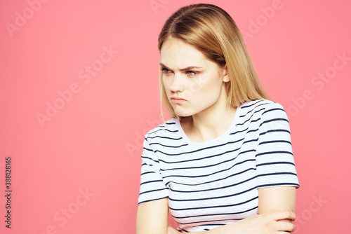 Blonde striped t-shirt emotion gesture hands displeased facial expression pink background