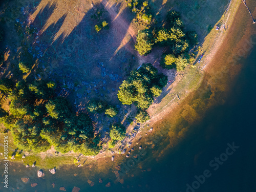 zenithal view with a lake and trees