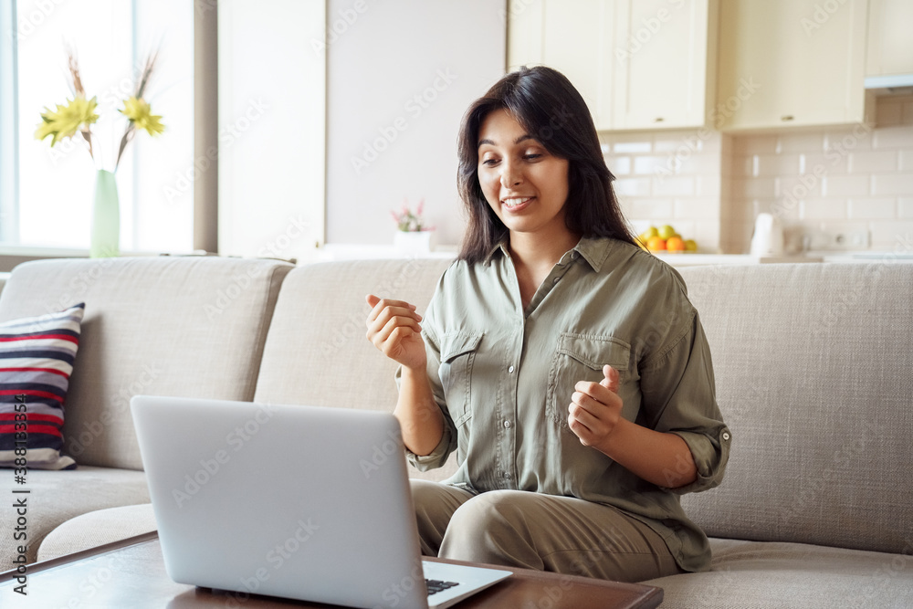 Young adult indian woman distance teacher, tutor, job applicant talking by video conference call using laptop computer work from home office. Virtual chat meeting, web counseling, remote job interview Young adult indian woman distance teacher, tutor, job applicant talking by video conference call using laptop computer work from home office. Virtual chat meeting, web counseling, remote job interview