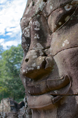 Smiling stone face at Bayon Temple in Cambodia