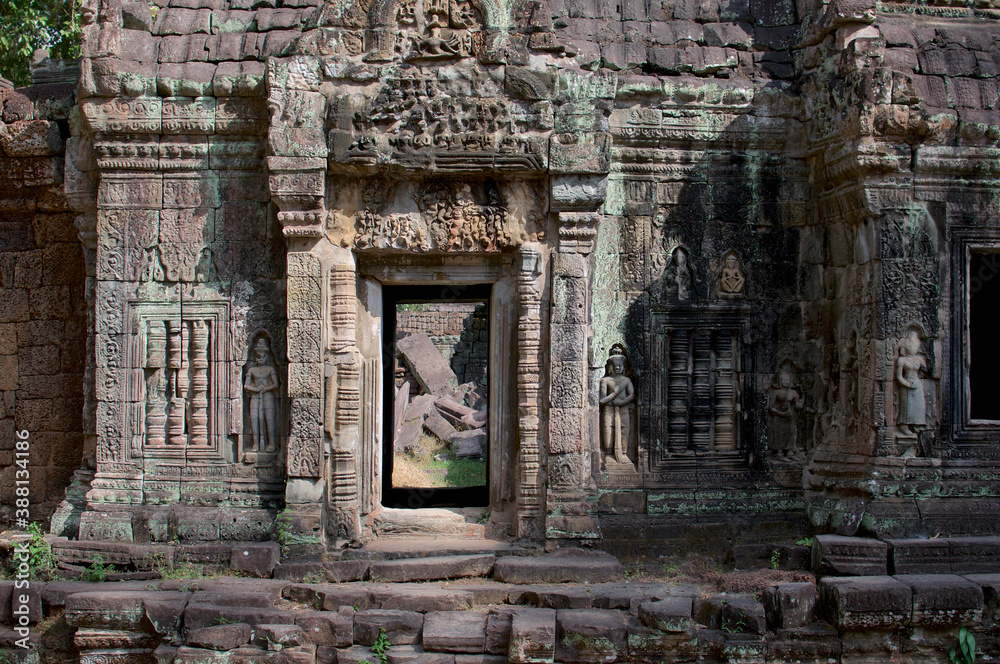Beauitful stone door at Ta Prohm temple building in Cambodia