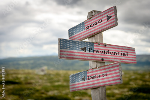 2020 presidential debate text on wooden signpost with the american flag on © Jon Anders Wiken